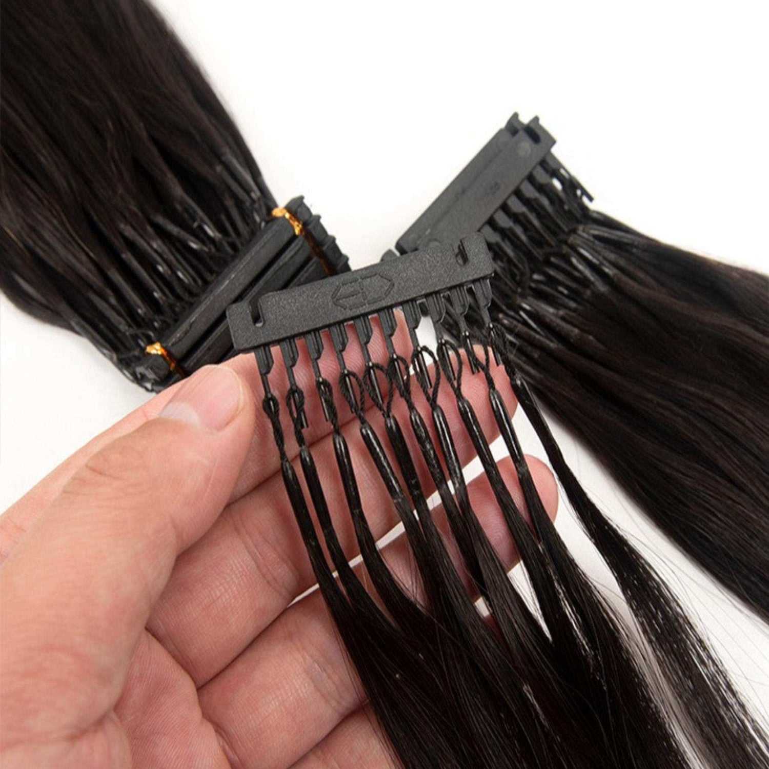 6D hair extensions 24 inch, human hair strands being held for installation.