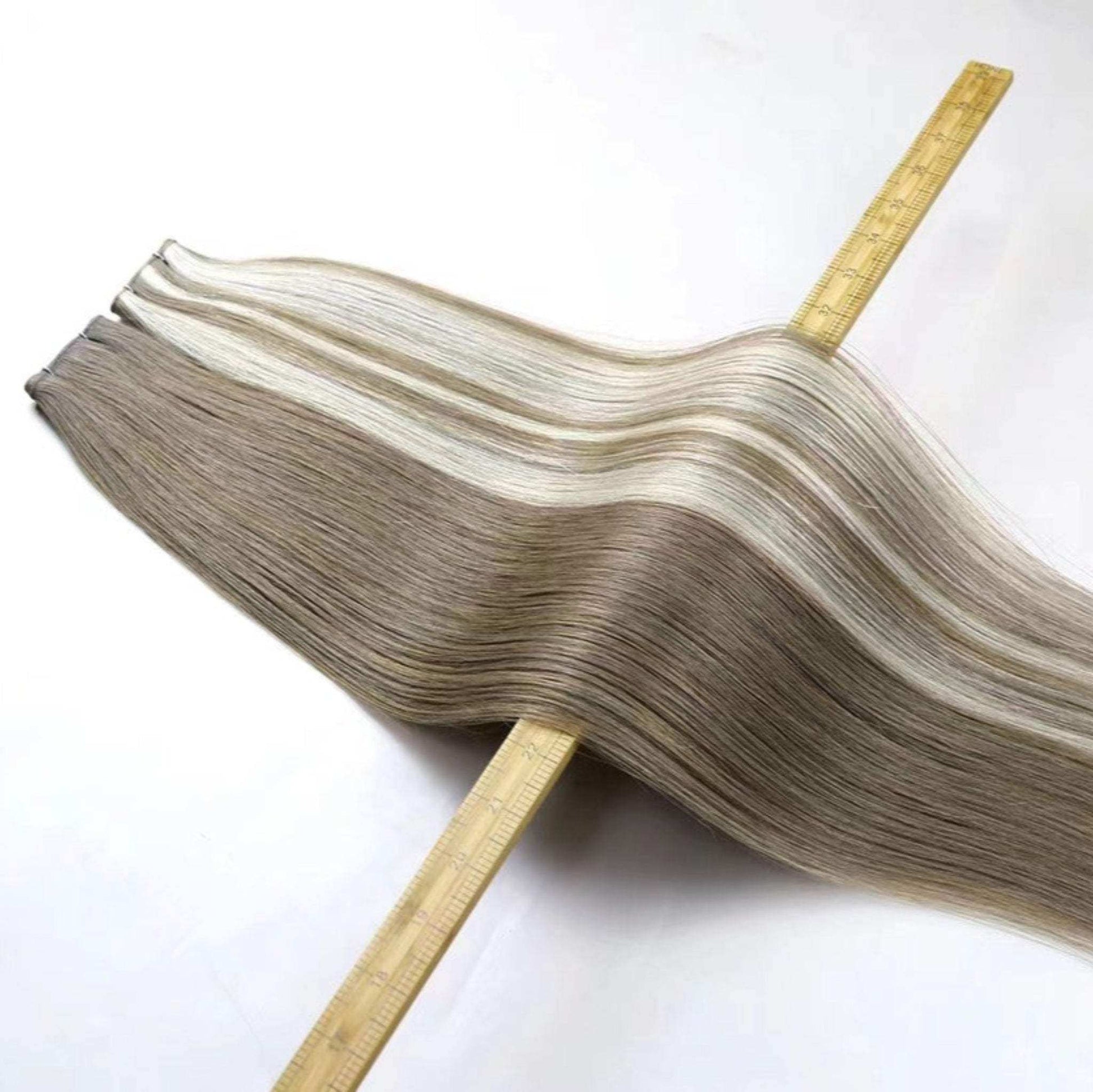 22-inch Genius Weft Extensions displaying smooth and natural human hair texture.