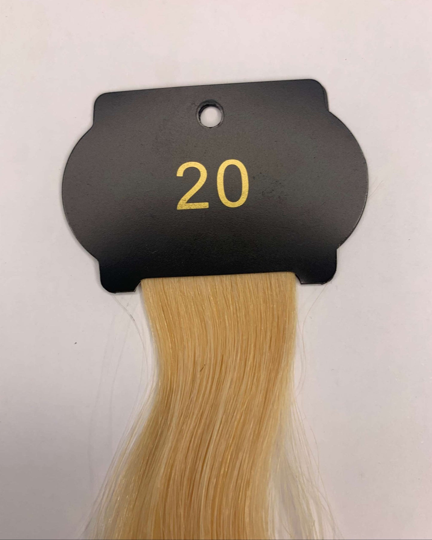 6D Hair Extensions, 26 Inch, human hair sample on black card, shade 20.