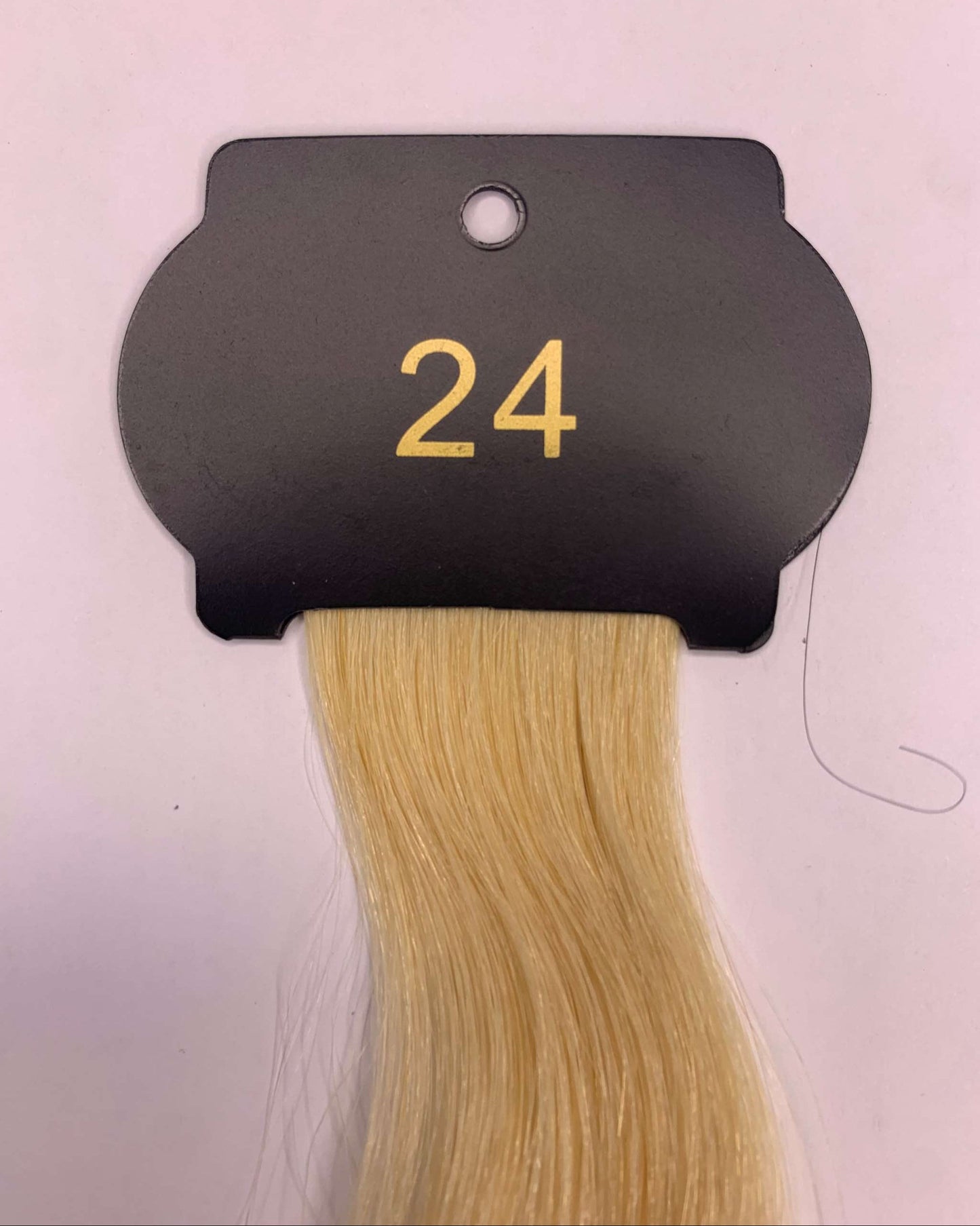 Blonde 6D hair extensions 26-inch length displayed on shade card.