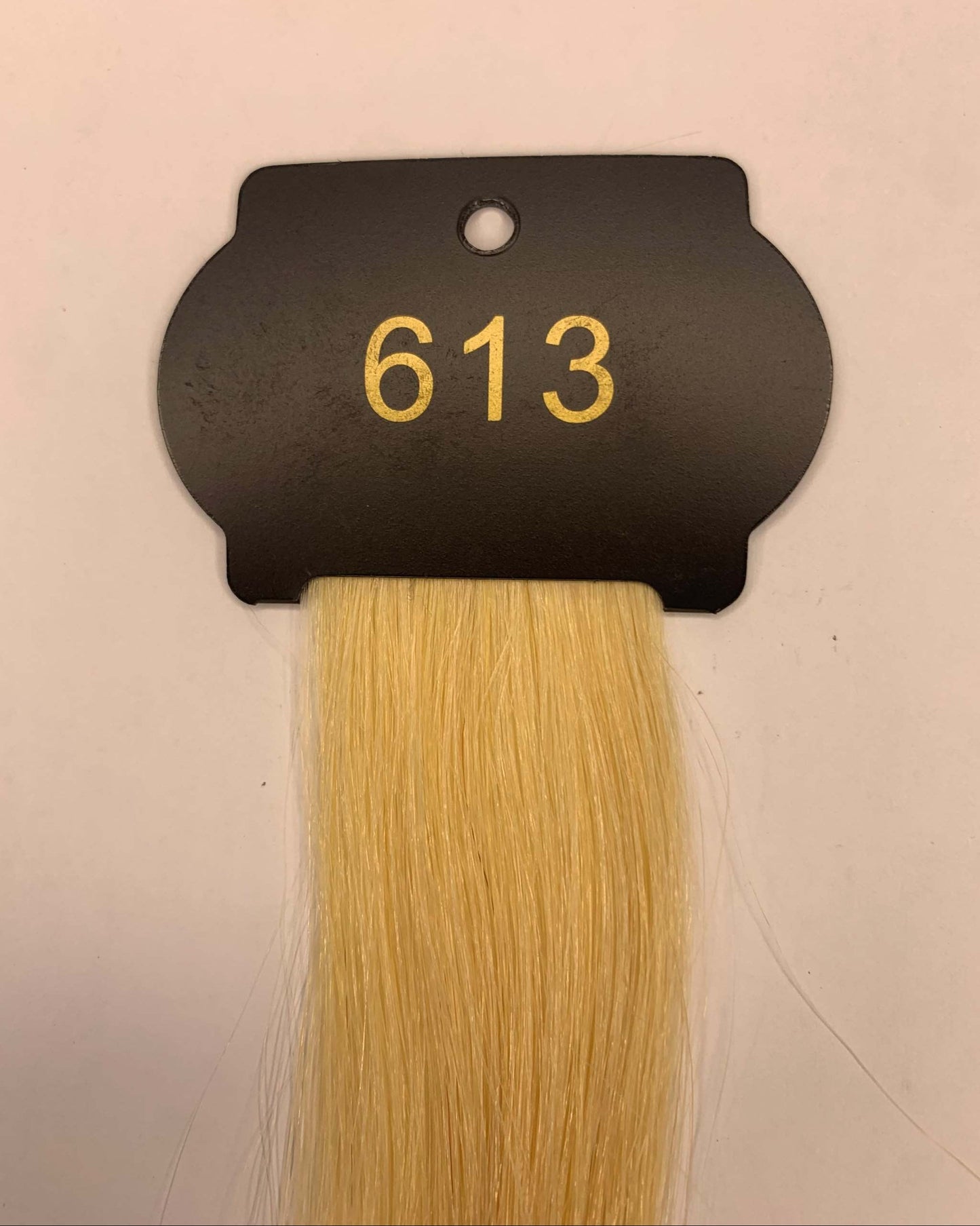 Blonde 6D hair extensions sample labeled "613" for 26-inch length.