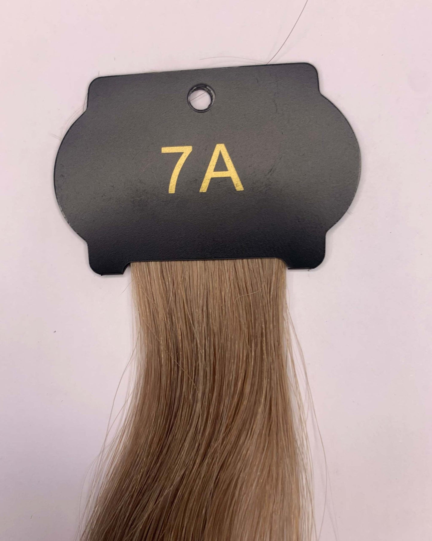 26-inch 6D hair extensions sample showing hair strand color and texture.