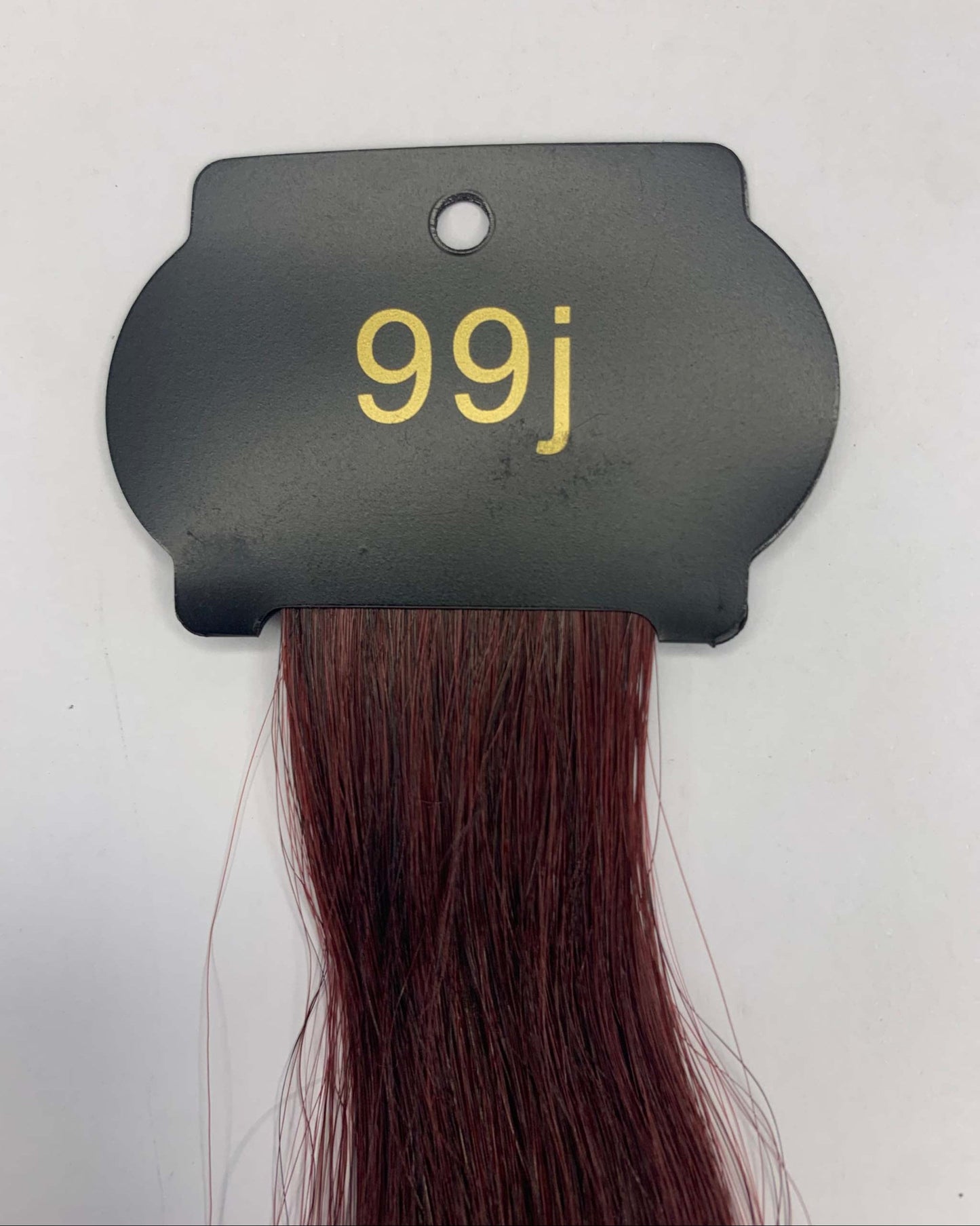 6D hair extensions, 26-inch length, shade 99j on display card.