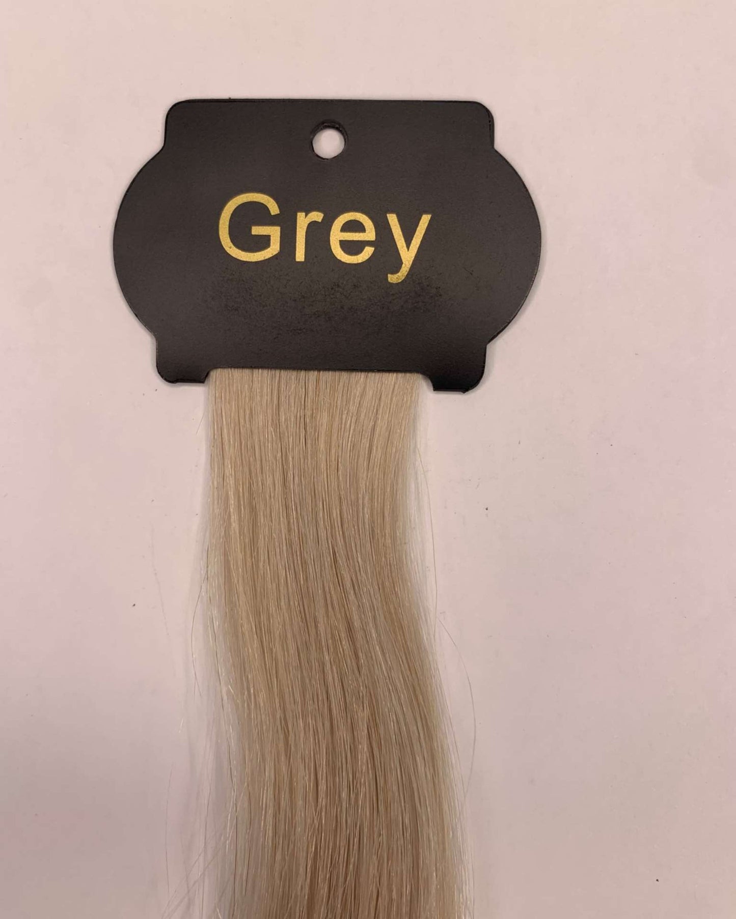 Grey 6D Hair Extensions, 26 inches, human hair strand sample for discreet and natural volume and length.