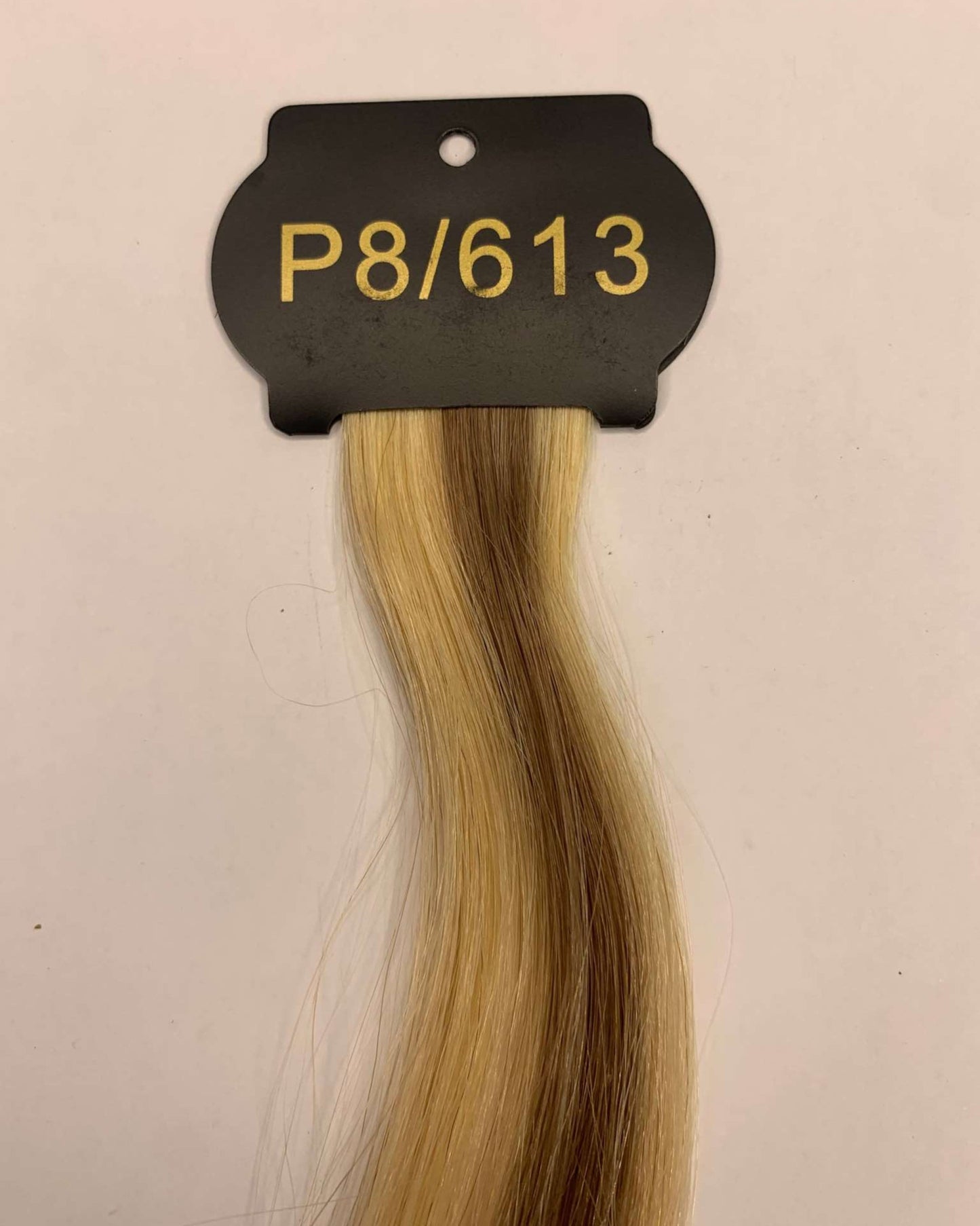 26-inch 6D hair extensions in blonde shade P8/613.