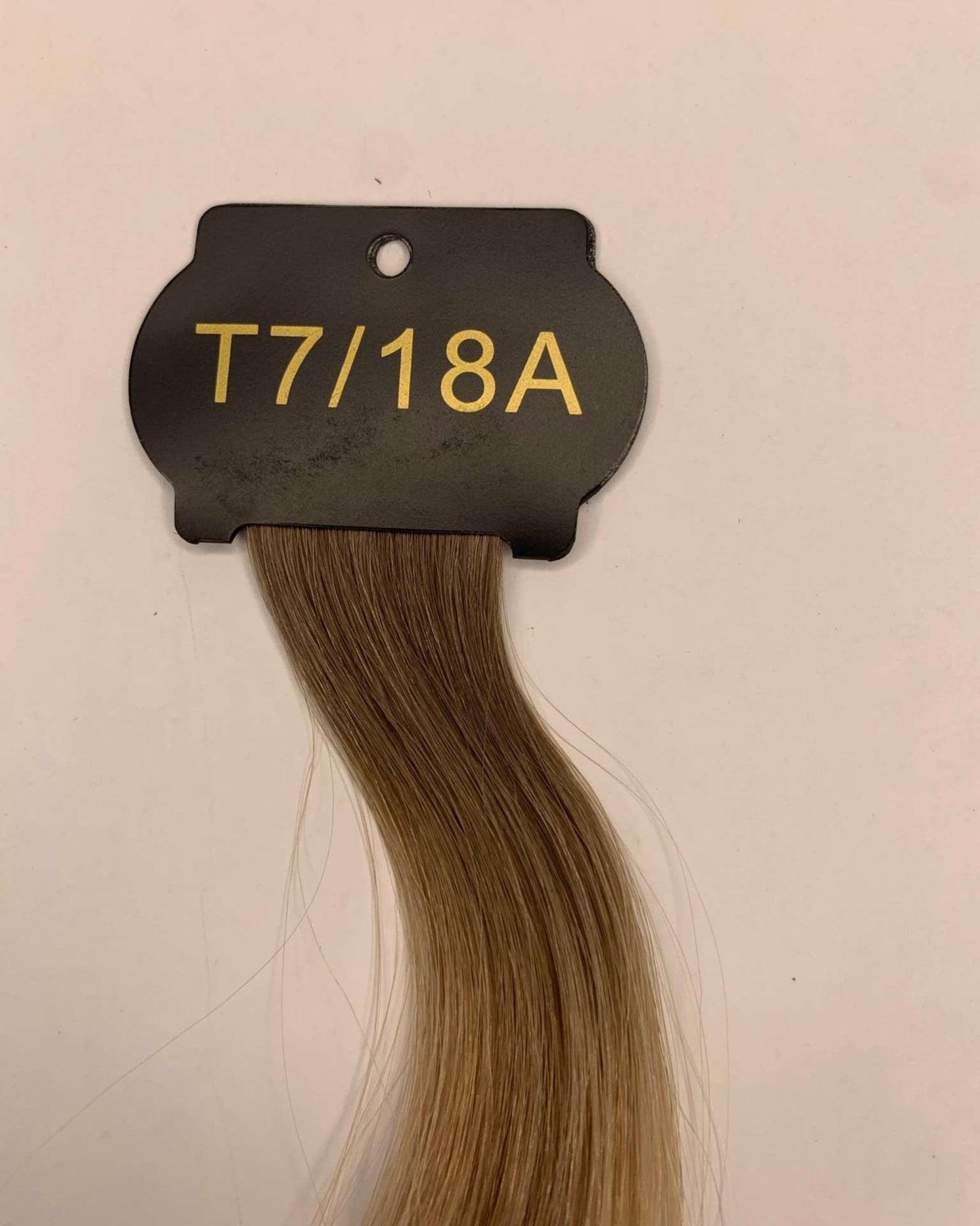 26-inch 6D hair extension sample in natural color labeled T7/18A.